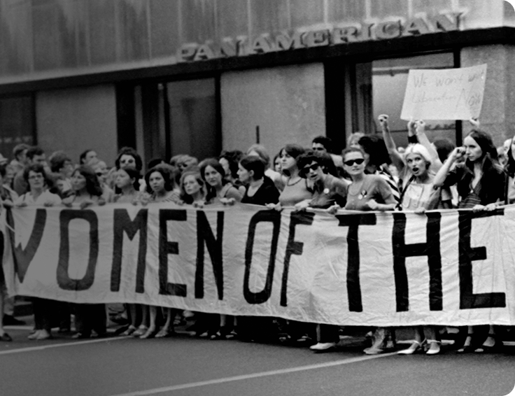 AdobeStock_533346420_Preview 2 (1) historical black and white photo of large crowd at womens right protest